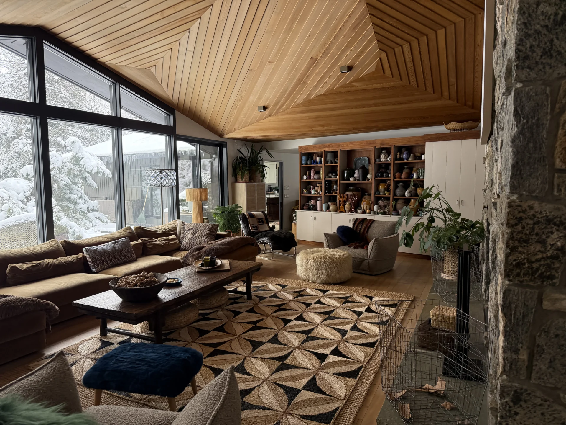 Saddle River Living Room with patterned rug and wood vaulted ceiling